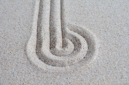 lines and circle formation on beach sand with customizable space for text