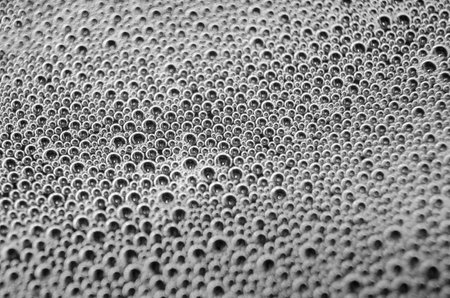 Top view of tiny bubbles on dark background.の写真素材