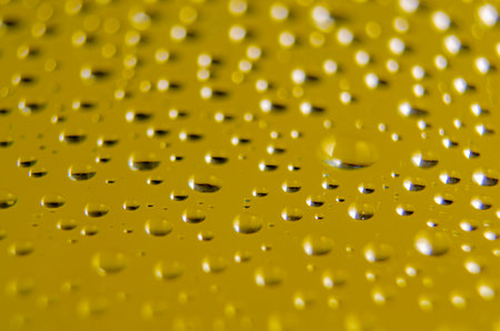 Water drops on a yellow background. Abstract background of water drops.の写真素材