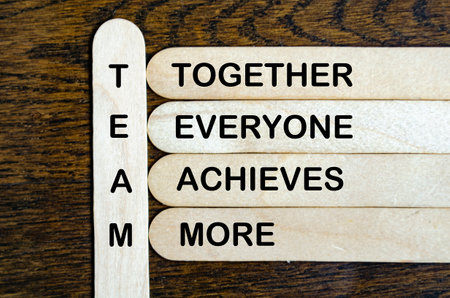 TEAM representing Together Everyone Achieves More text on wooden stickの写真素材