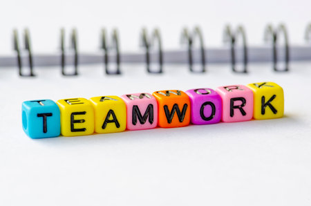 Teamwork text on colorful plastic alphabet beads.の写真素材
