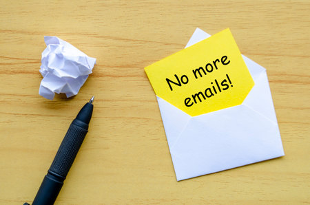 No more emails text on yellow paper in an envelope. Resignation concept.の写真素材