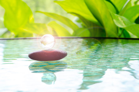 Bright shining glass marble representing peace and harmony with customizable space for text of...