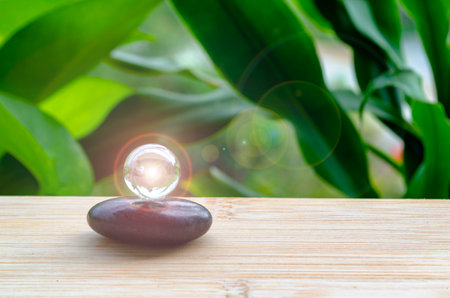 Black Zen stone with customizable space for text or message. Shining glass marble background