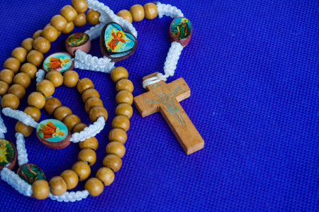 Holy Rosary on purple cloth reminds us of Christ royalty and divine passion