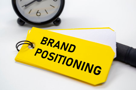 Branding positioning text in bold black font on yellow sticky note