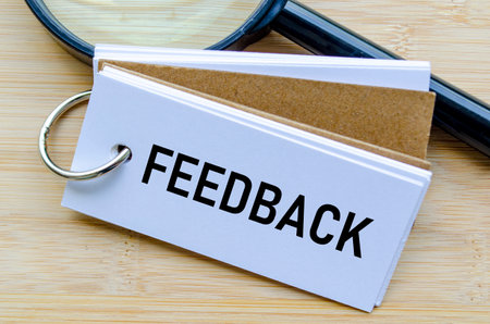 Feedback text on notepad reflecting employee opinions and workplace improvement strategies.