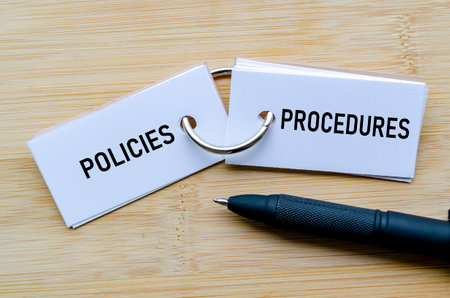 Policies and Procedures text on notepad representing operational guidelines and internal controls.の写真素材