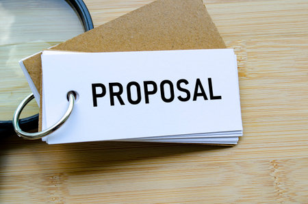 Proposal text on notepad denoting submission of ideas, business bids, or plans.の写真素材