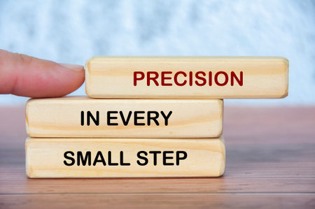 Precision in every small step comes into focus as fingers define each block, echoing accuracy, diligence, and uncompromising attention to detail.の写真素材