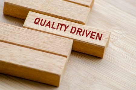 Quality Driven text on wooden blocks. Business and Quality control conceptの写真素材