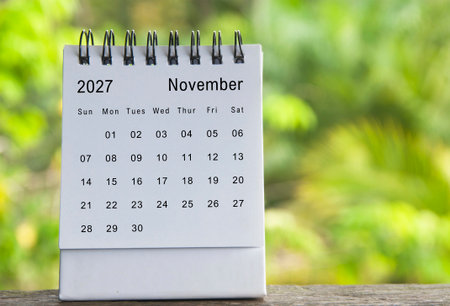 November 2027 calendar with blurred nature background.