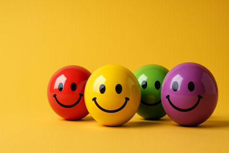Playful arrangement of cheerful spheres in varied colors symbolizing the balance and interconnectedness of diversity, inclusion, and equity in group dynamics.の素材