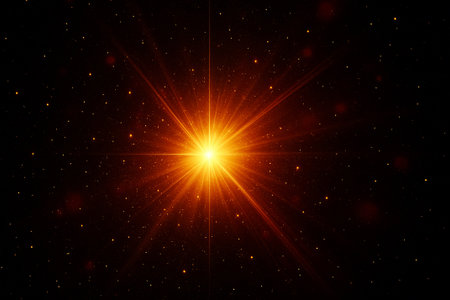Fiery glowing orange burst with radiant streaks spreading outward in space.の素材