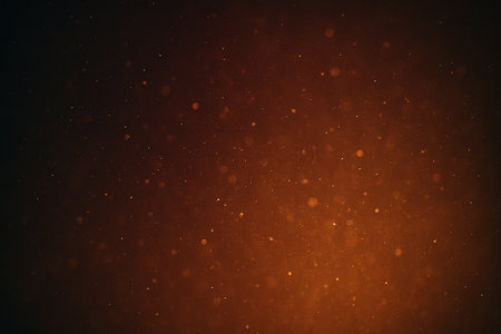 Dark cosmic gradient with scattered glowing red light specks resembling stars.の素材