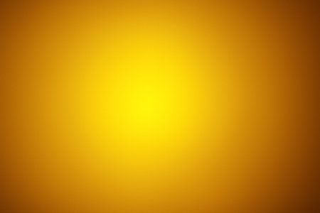 Deep amber tone with radiant glowing golden center illumination.の素材