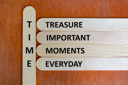Wooden stick acronym TIME reminding people to value moments, practice mindfulness, and cherish...