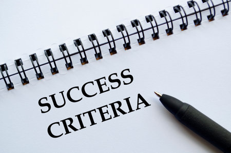 A professional notebook with pen showing success criteria concept.の写真素材