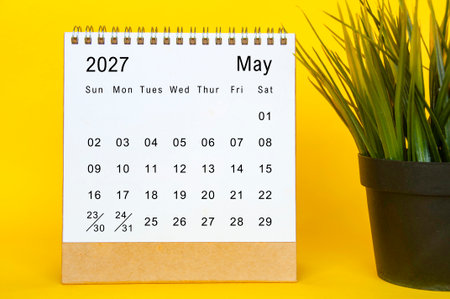 May 2027 modern monthly desk calendar page with yellow edge design and green plant detailの写真素材