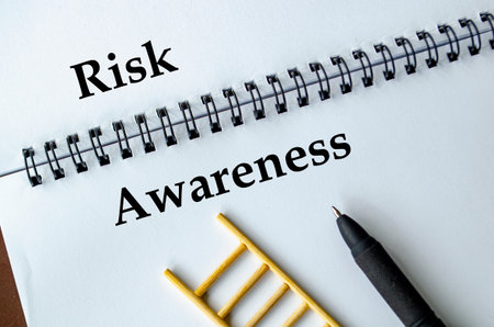 Risk Awareness, Notebook with ladder illustration symbolizing preparedness, responsibility, and...