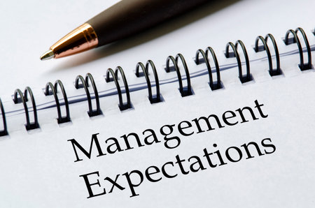 Close up notepad with the title Management Expectations written clearly on its pageの写真素材