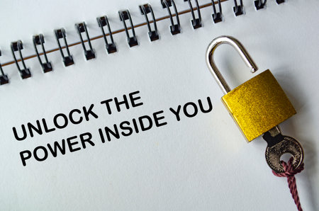 UNLOCK THE POWER INSIDE YOU, Inspirational notepad with yellow padlock and key emphasizing inner...