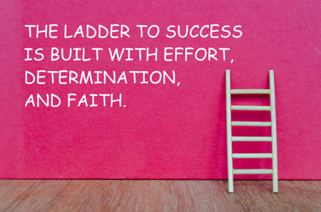 A wooden ladder with text THE LADDER TO SUCCESS IS BUILT WITH EFFORT, DETERMINATION AND FAITH...
