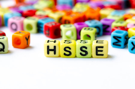 Close up of HSSE text on yellow cubes representing Health, Safety, Security and Environment. Health and Safety conceptの写真素材