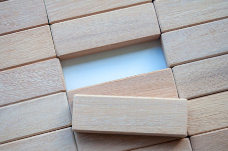 Top view of wooden blocks on white background with customizable space for textの写真素材