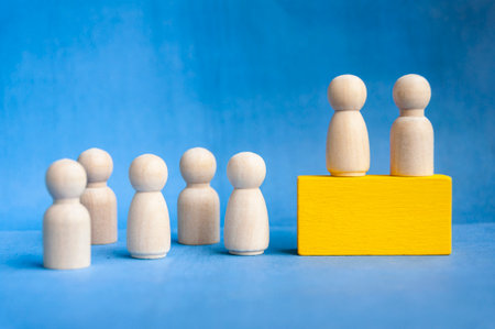 Two wooden peg figures on yellow block with blue backdrop showing unity theme with customizable...