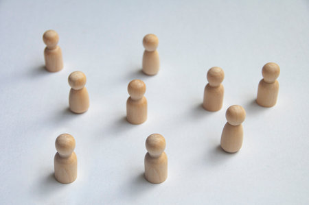 Top view of wooden pegs following a leader with customizable space for text.の写真素材