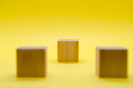An isolated wooden cube with customizable space for text or ideas. Copy space conceptの写真素材