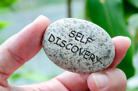 Self Discovery text engraved on dark stone. Life harmony conceptの写真素材