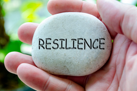 Resilience text engraved on white stone. Life harmony conceptの写真素材