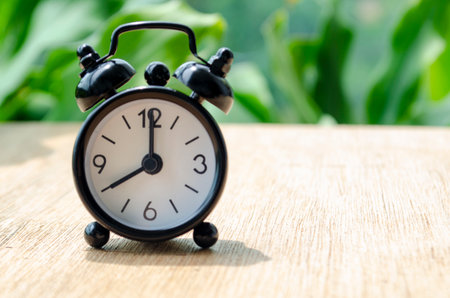 Alarm clock pointing at 8 pm with customizable background space for text or ideas