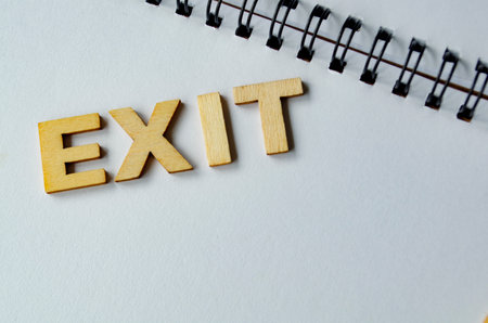 EXIT text on white notepadの写真素材