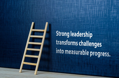 Strong LEADERSHIP begins transforms challenges into measurable progress text on black cover backgroundの写真素材