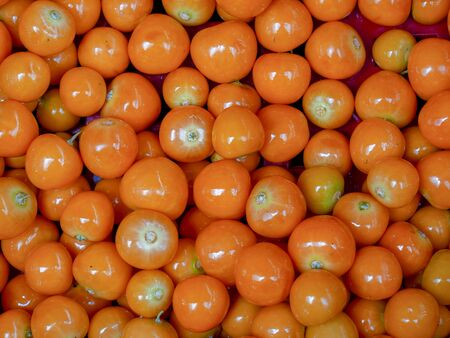 A heap of goldenberries photographed at the traditional local market of the colonial town of Villa de Leyva, in the Andean mountains of central Colombia.の写真素材