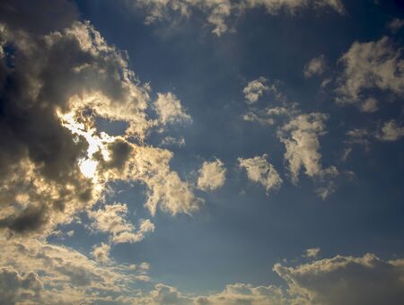 Multiple exposure of dense gray clouds hiding the sun in the afternoon. Captured at the Andean mountains of central Colombia.の写真素材