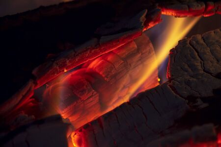 Macro photography of some logs burning in a fireplace. Captured at the Andean mountains of central Colombia.の写真素材
