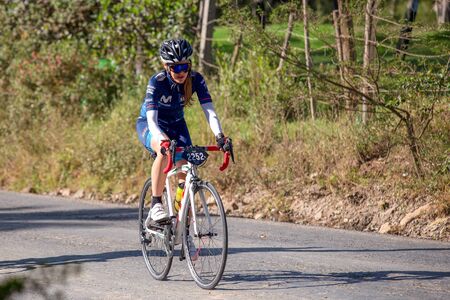 Villa de Leyva, Boyaca, Colombia - December 1, 2019:  Men and women of all ages ride bicycles during...