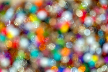 Abstract colorful background from a unfocused macro photography of a pile of plastic beadsの写真素材