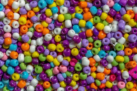 Macro photography of some colorful beads of different shape used for manufacturing jewerly and accesories.の写真素材