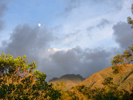 The Andean mountains with the moon at sunset near the town of Villa de Leyva in central Colombia.の写真素材