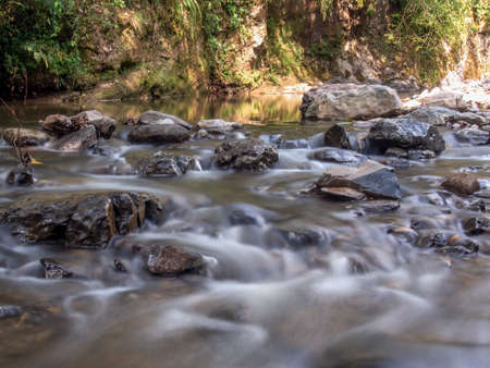 Multiple long exposure composite of the stream of the Moniquira river, a tropical tributary of the Suarez river, captured near the town of the same name in central Colombia.の写真素材