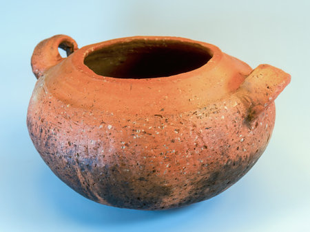 Studio shot of an old used traditional clay cooking pot on a neutral backgroundの写真素材