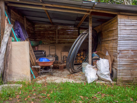 View of the tools and assorted objects in a rustic shed in a farm near the colonial town of Villa de Leyva in central Colombiaの写真素材