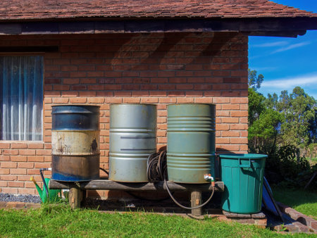 A home made rain water collector system made from steel barrels, in a farm near the colonial town of Villa de Leyva in central Colombia.の写真素材