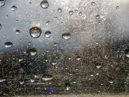 Macro photography of some rain drops on a window glass, captured on a farm in the eastern Andean mountains of central Colombia.の写真素材