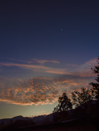 View of the magnificent colors of dawn on a particular cloud formation over the Iguaque natural reserve, in the eastern Andean mountains of central Colombia.の写真素材